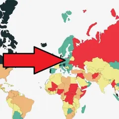 Czerwona strzałka wskazuje na Europę, gdzie niektóre kraje są zielone, sugerując, że są najbezpieczniejszym krajem na świecie.