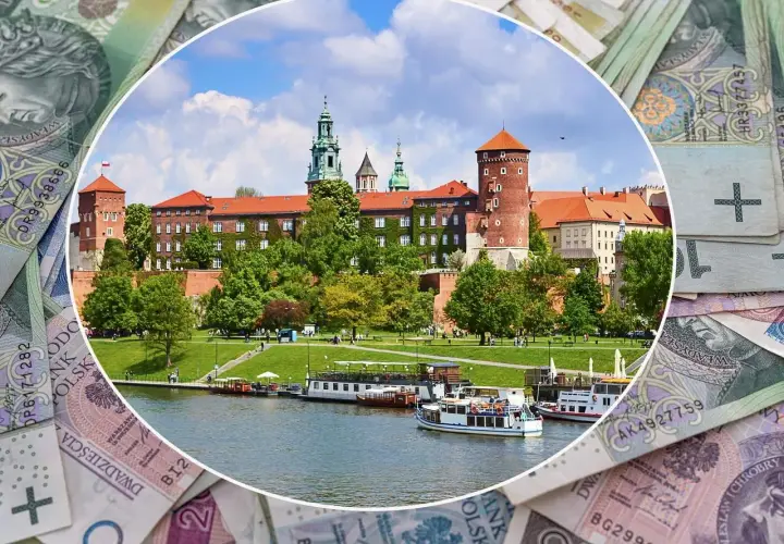 Zamek Królewski na Wawelu, symbol Krakowa, w województwie małopolskim. W tle polskie banknoty.